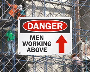 Men Working Above Sign