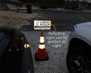 Curbside sign is reflective and can be seen at night