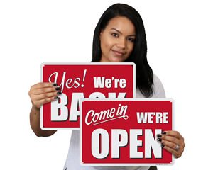 We are open and back in business signs