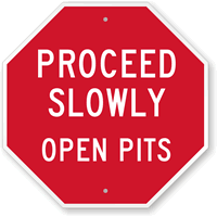 Proceed Slowly Open Pits Sign