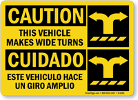 Bilingual Vehicle Makes Wide Turns Caution Sign