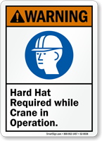 Hard Hat Required While Crane In Operation Sign