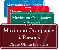 Maximum Occupancy 2 People Utilize The Stairs ShowCase Sign