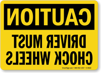 Caution Driver Must Chock Wheels Mirrored Image Sign