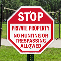 STOP: Private Property No Hunting or trespassing sign