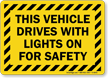 Vehicle Drives With Lights On For Safety Sign