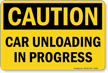 Car Unloading in Progress OSHA Caution Sign