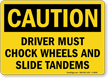 Driver Must Chock Wheels And Slide Tandems Sign