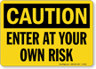 Enter At Your Own Risk OSHA Caution Sign