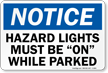 Hazard Lights Must Be On Notice Sign