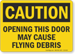 Opening This Door May Cause Flying Debris Caution Sign