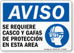 Spanish Helmet and Goggles Required In Area Sign