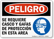 Spanish Helmet and Goggles Required In This Area Sign