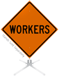 Workers Roll Up Sign