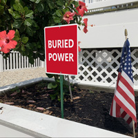 Warning sign: Buried power lines below