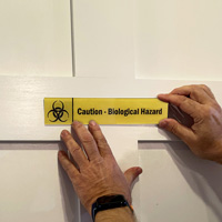 Caution: Biological Hazard Sign on a Door
