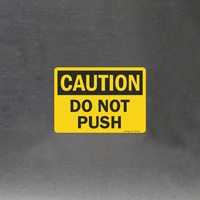 Prohibited action Do not push - OSHA sign