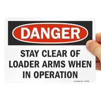 Danger Sign: Loader Arms in Operation
