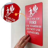 In case of fire use stair sign with braille and tactile lettering