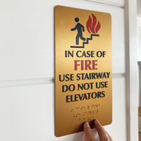 Gold fire exit sign