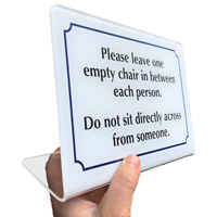 Leave empty chair between each person sign