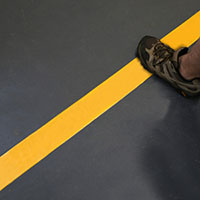 Carpet tape with 2-inch solid yellow marking