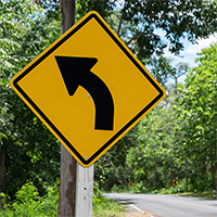 Left Curve Symbol - Traffic Signs