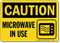 Microwave In Use Caution Sign